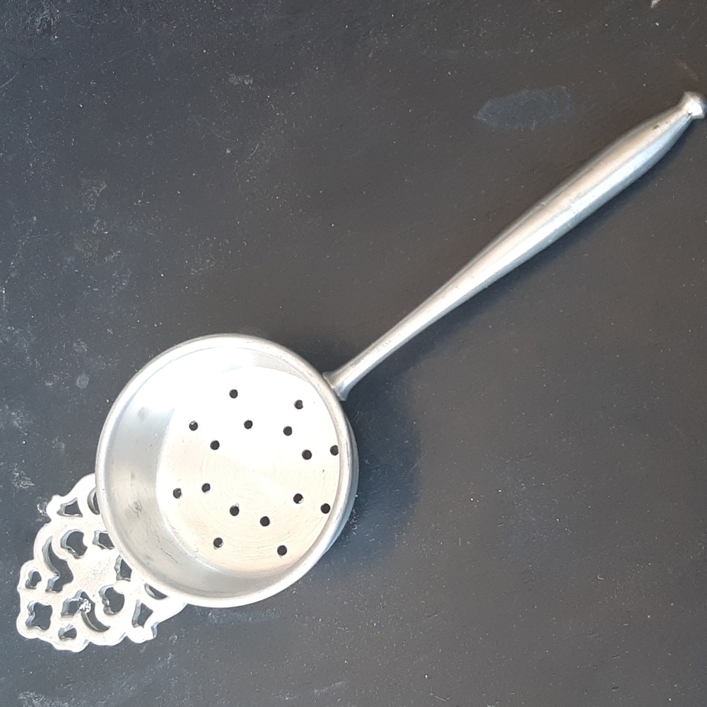Vintage fancy topped pewter tea strainer